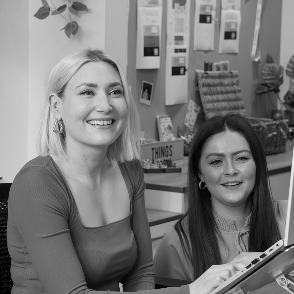 Full-service marketing agency team reviewing project