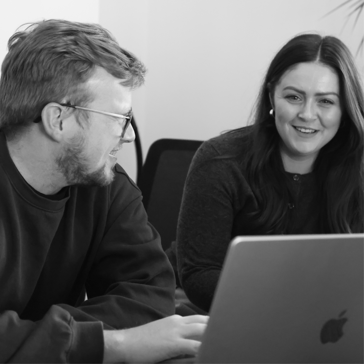 Team reviewing paid search results together on a laptop