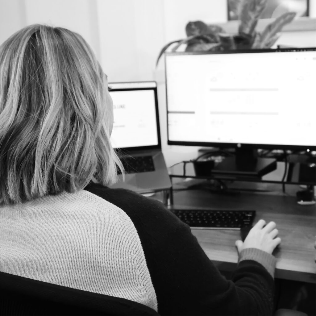 Team member working on website design and analytics
