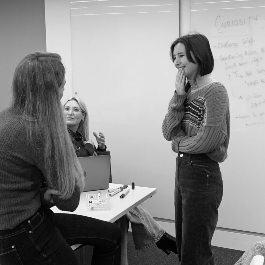 Marketing team collaborating in a creative PR strategy meeting