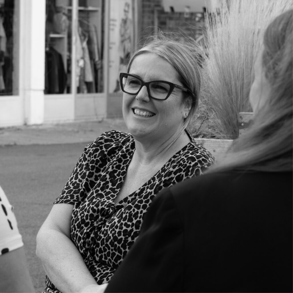 Photoshoot of our marketing team, Michelle, Sarah and Ellie strategising 