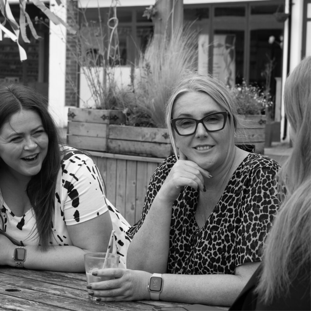 Photoshoot of our marketing team, Michelle, Sarah and Ellie strategising 
