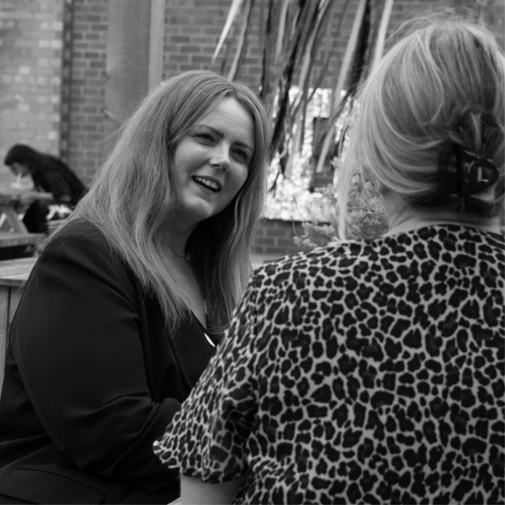 Photoshoot of our marketing team, Michelle, Sarah and Ellie strategising 
