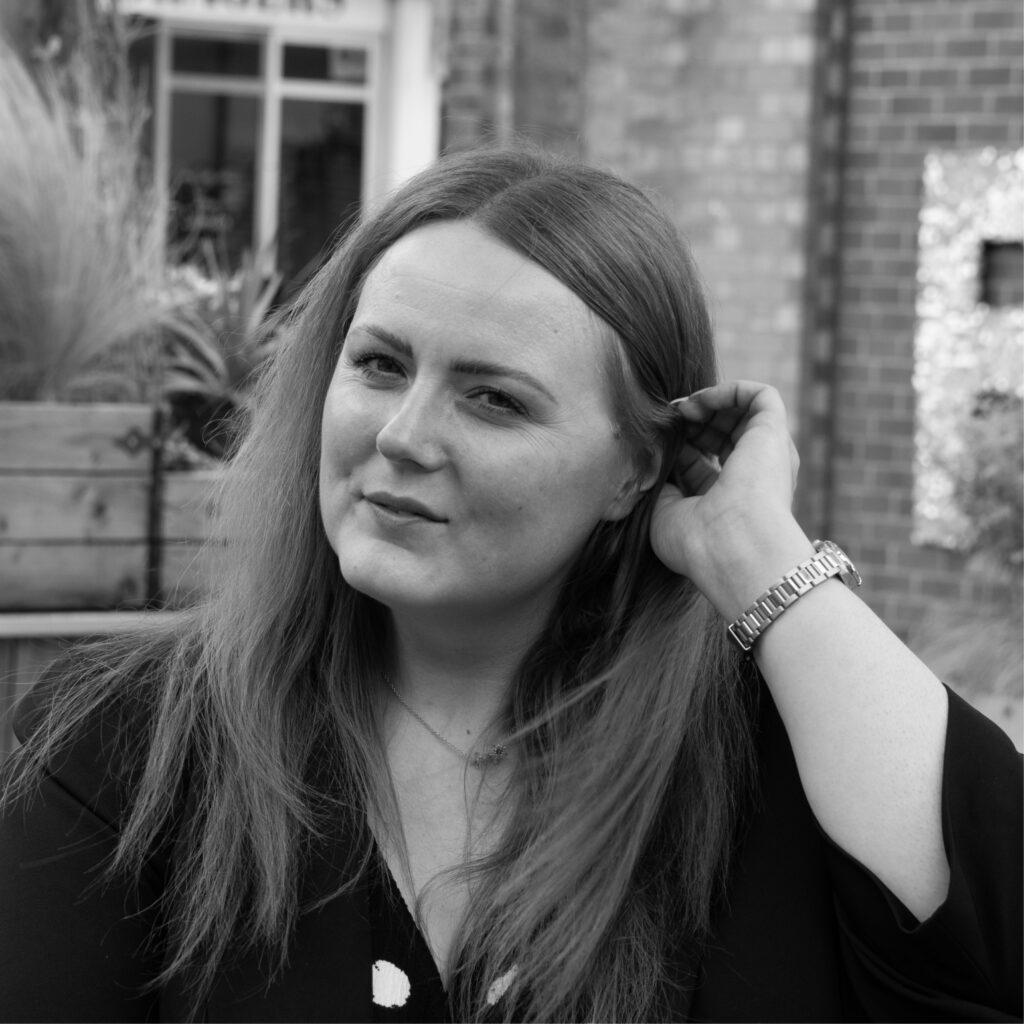 Photoshoot of our marketing team, Michelle, Sarah and Ellie strategising 