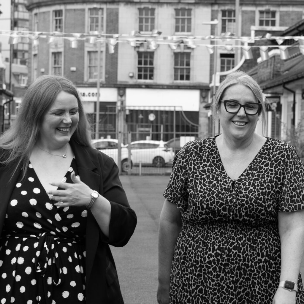 Photoshoot of our marketing team, Michelle, Sarah and Ellie strategising 
