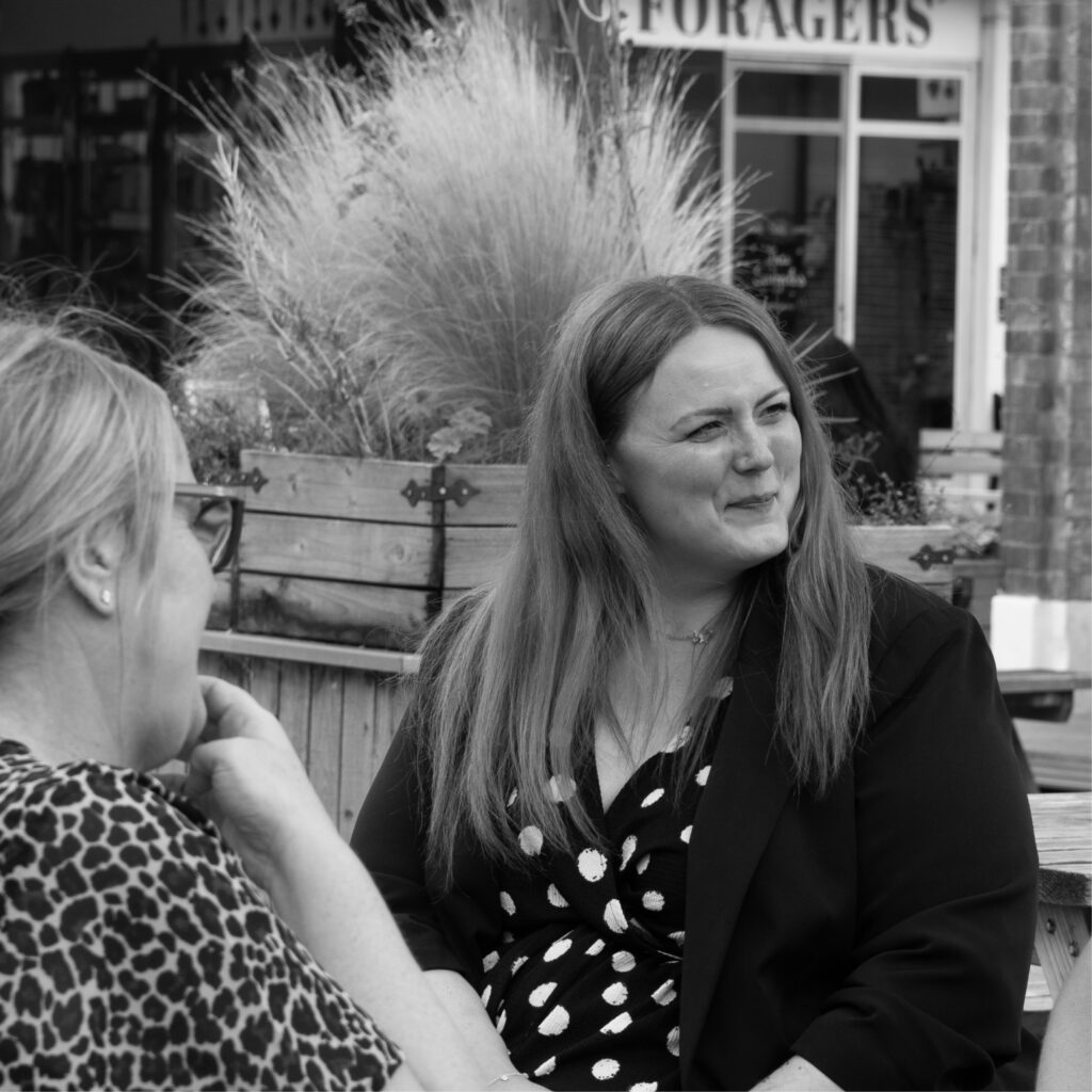 Photoshoot of our marketing team, Michelle, Sarah and Ellie strategising 