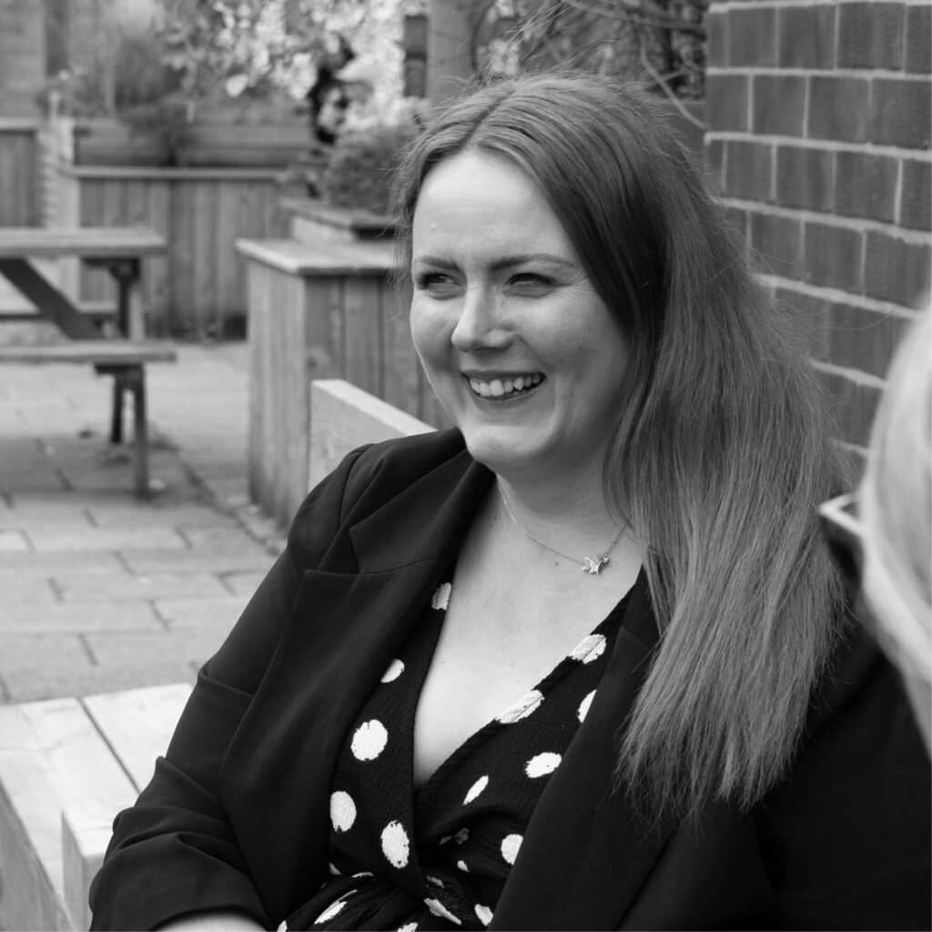 Photoshoot of our marketing team, Michelle, Sarah and Ellie strategising 