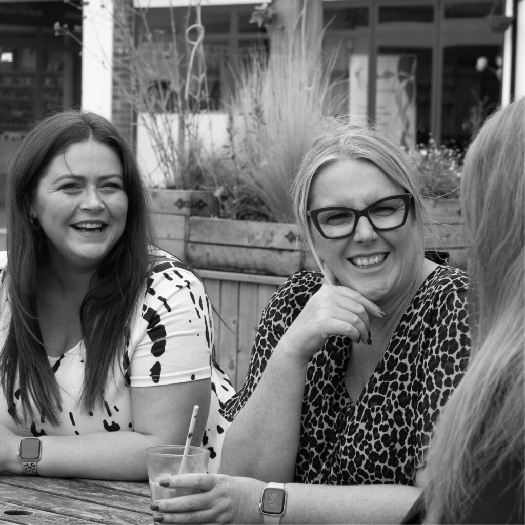 Photoshoot of our marketing team, Michelle, Sarah and Ellie strategising 