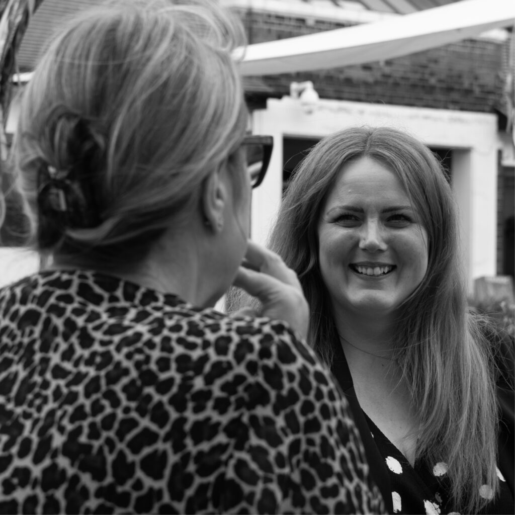 Photoshoot of our marketing team, Michelle, Sarah and Ellie strategising 