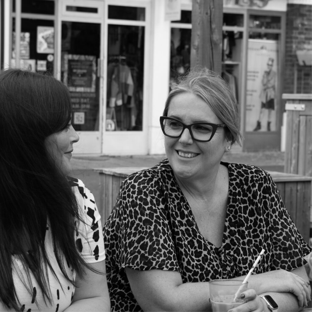 Photoshoot of our marketing team, Michelle, Sarah and Ellie strategising 