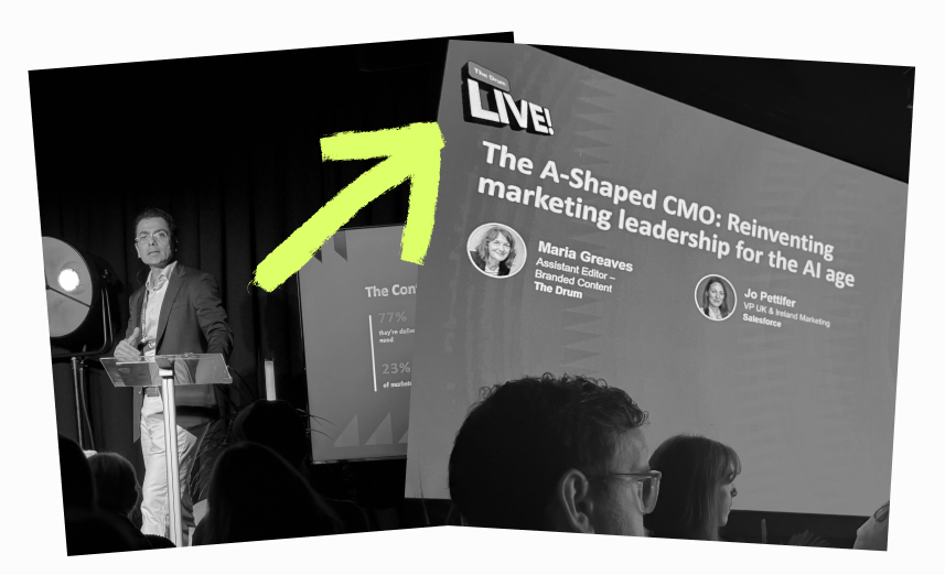 Speaker at a lectern and event presentation slide
